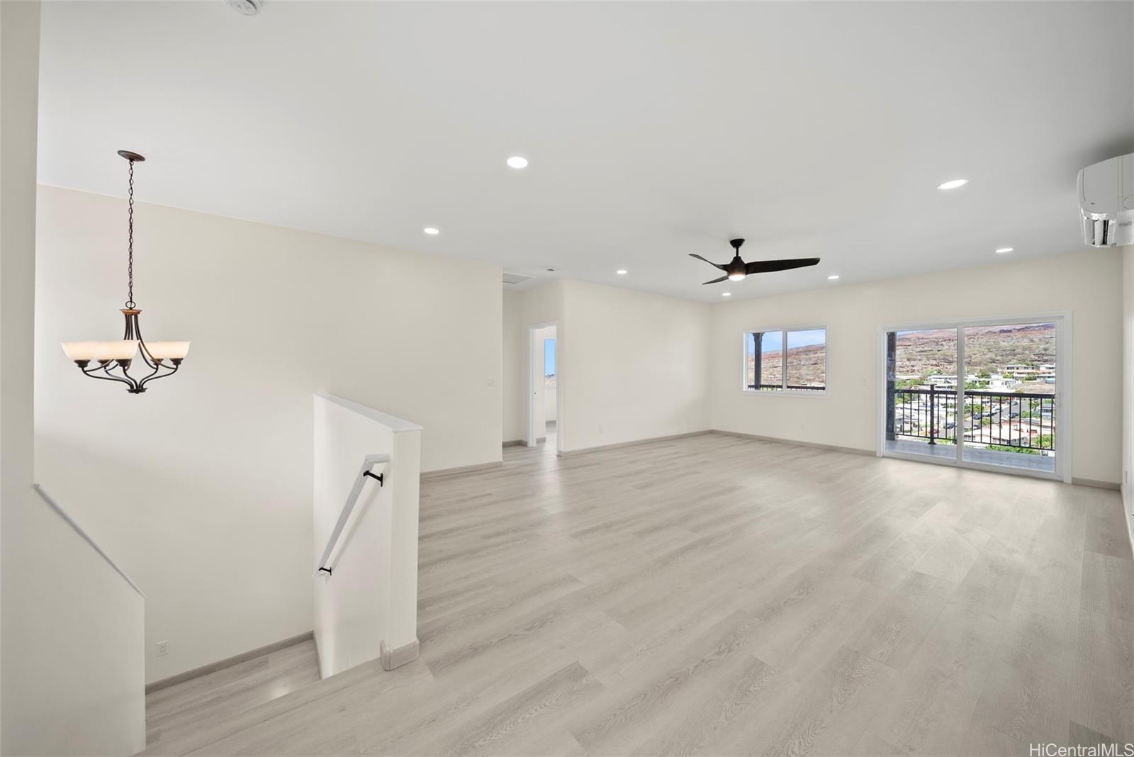 92-792 A Ahikoe Street Kapolei, HI 96707 - Photo 8 of 25 a view of a kitchen with a sink and a refrigerator