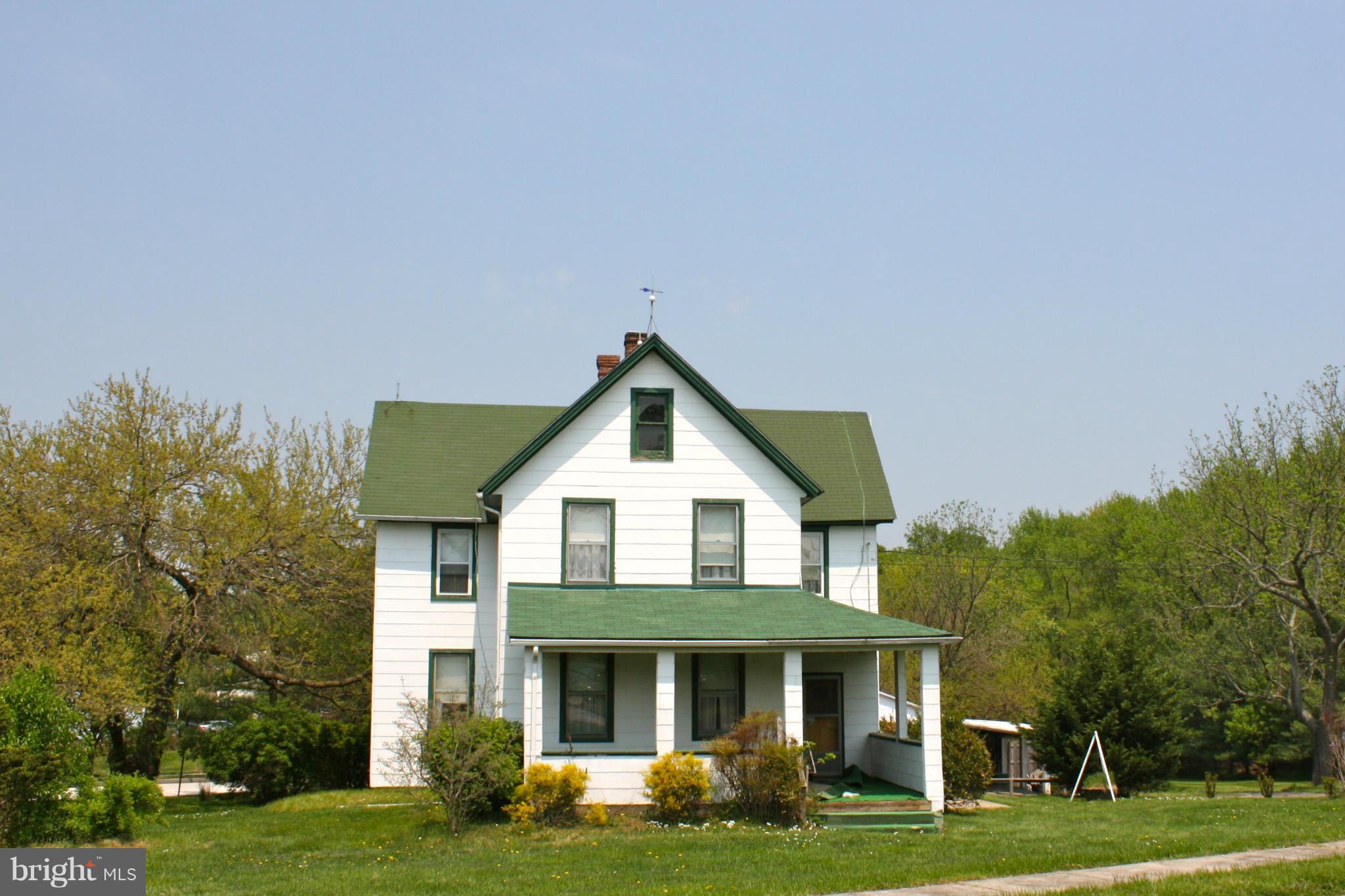 4622 East Joppa Road Perry Hall, MD 21128 - Photo 1 of 29 a front view of a house with a garden and trees