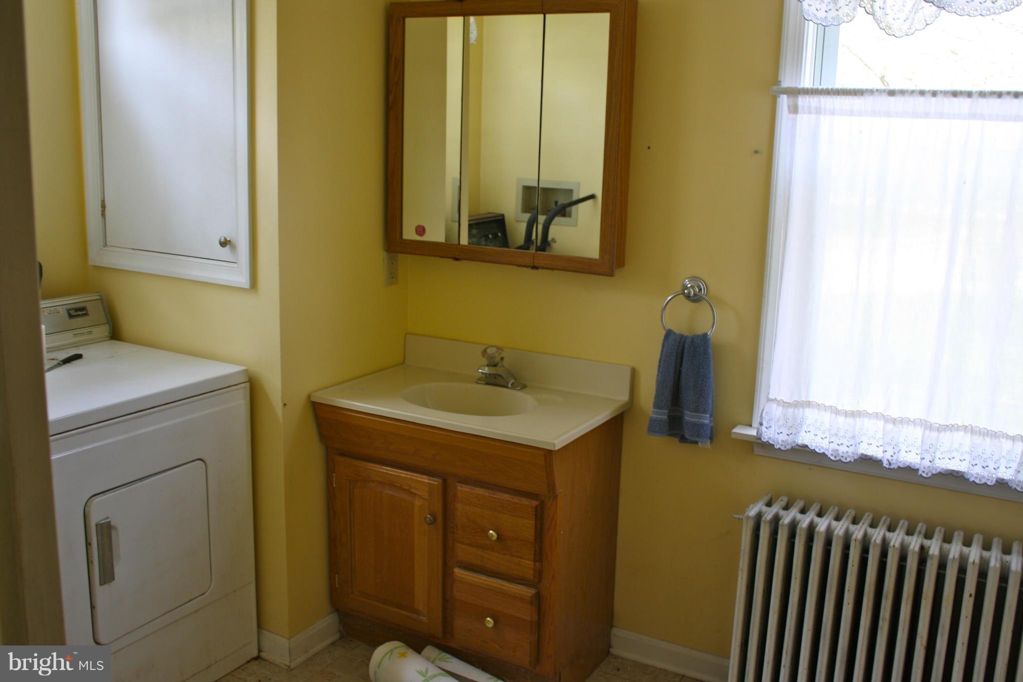 4622 East Joppa Road Perry Hall, MD 21128 - Photo 15 of 29 a bathroom with a sink and a mirror