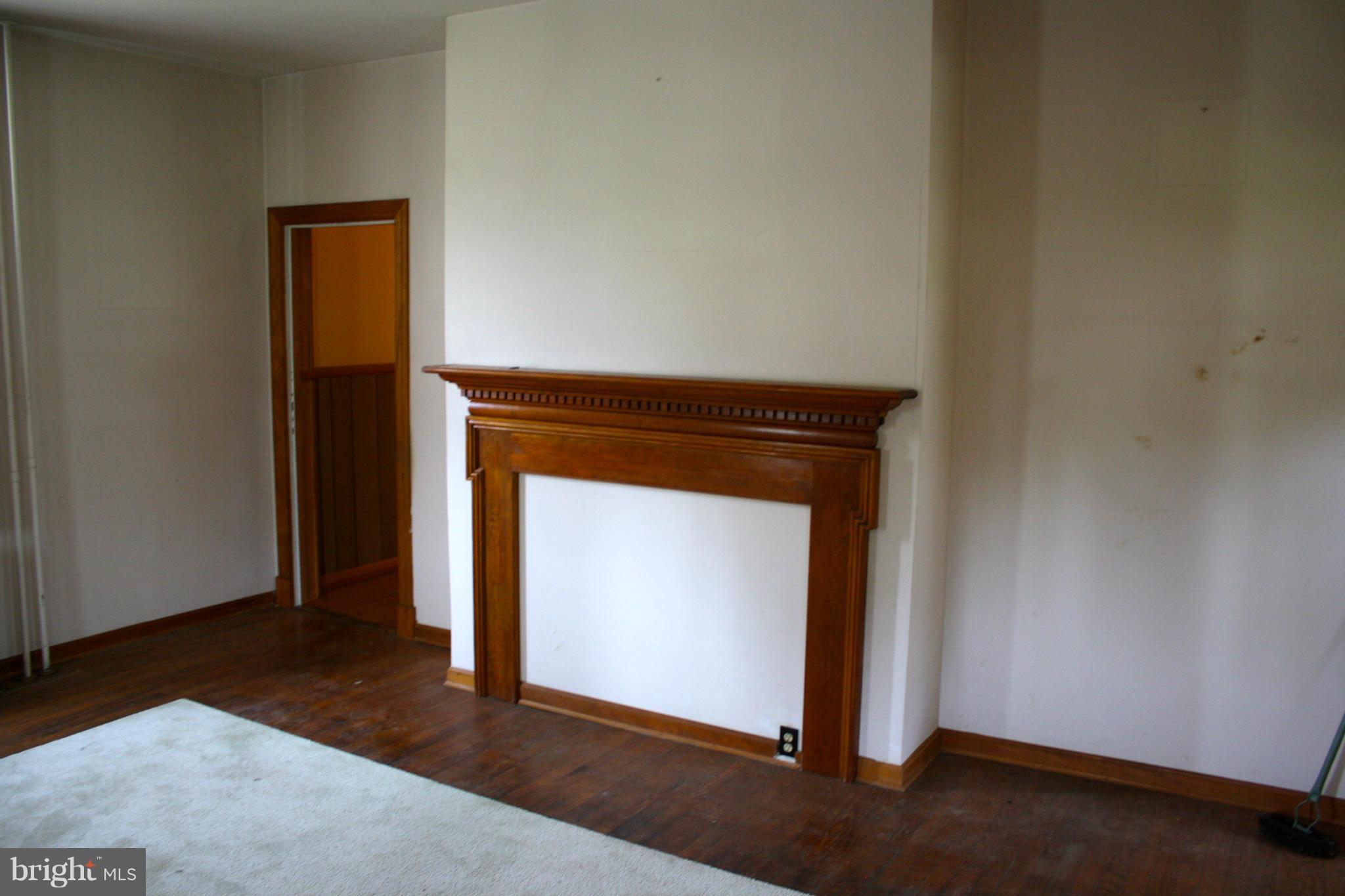 4622 East Joppa Road Perry Hall, MD 21128 - Photo 18 of 29 a room with a mirror and a wooden door