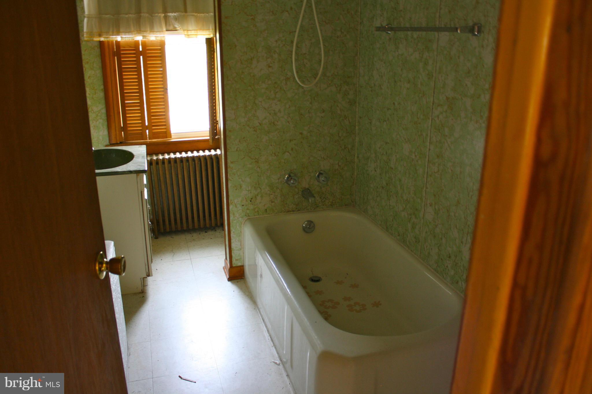 4622 East Joppa Road Perry Hall, MD 21128 - Photo 24 of 29 a bathroom with a tub toilet and sink