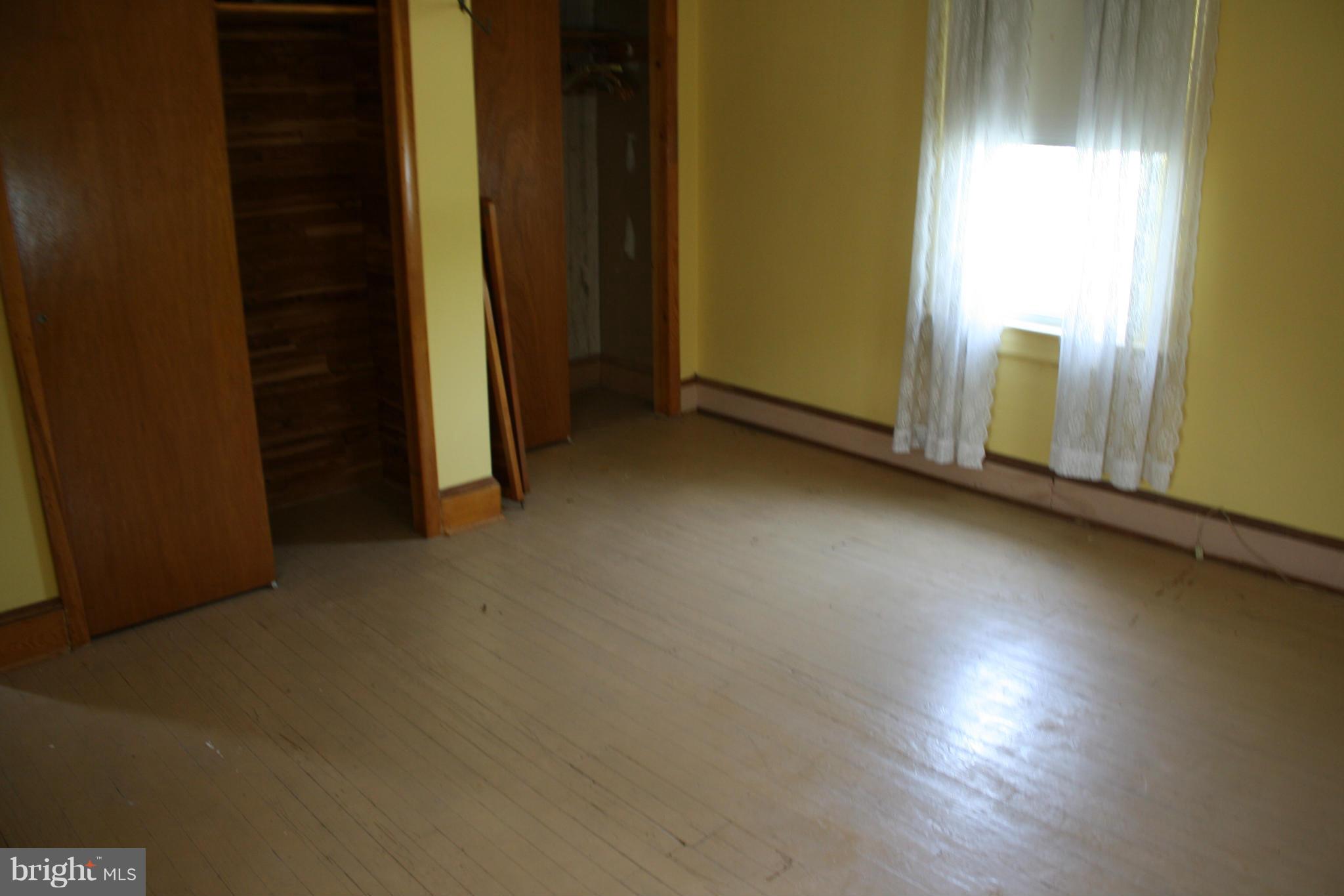4622 East Joppa Road Perry Hall, MD 21128 - Photo 26 of 29 an empty room with wooden floor and windows