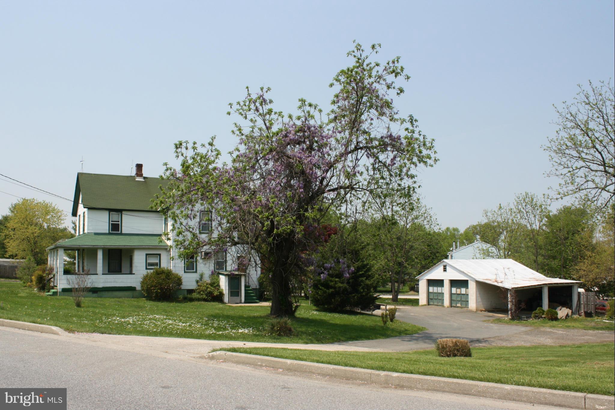 4622 East Joppa Road Perry Hall, MD 21128 - Photo 5 of 29 a front view of a house with a yard and trees