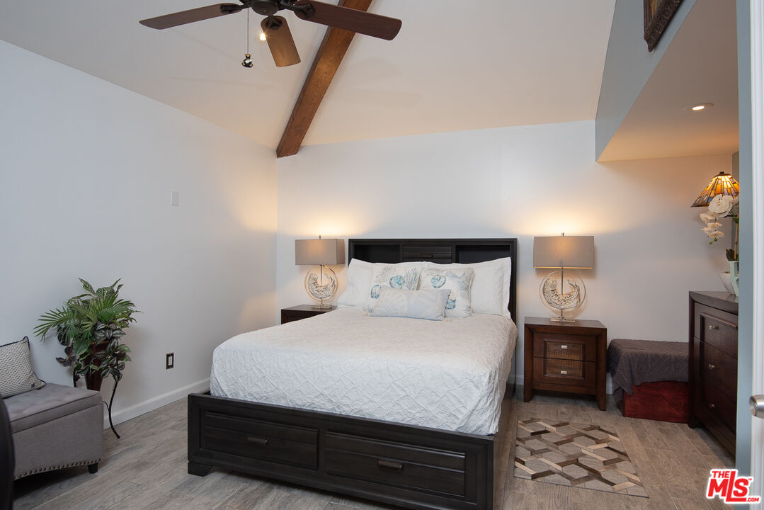 8308 Flight Avenue, Unit ADU Los Angeles, CA 90045 - Photo 16 of 27 a bedroom with a bed a couch and potted plant