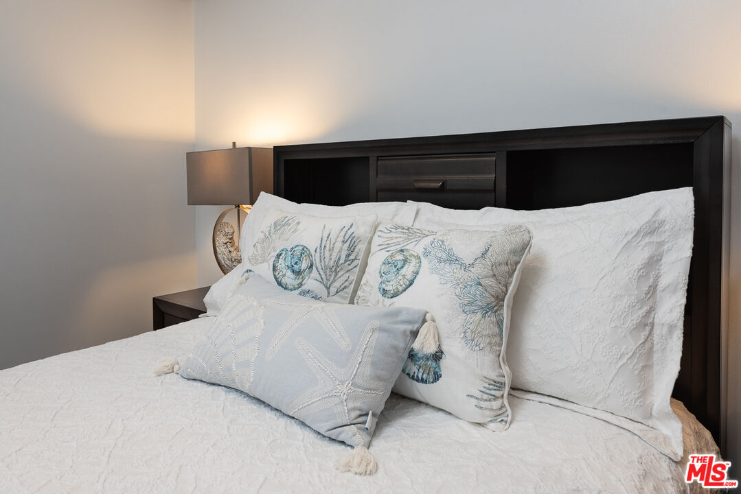 8308 Flight Avenue, Unit ADU Los Angeles, CA 90045 - Photo 17 of 27 a large bed sitting in a bedroom next to a window