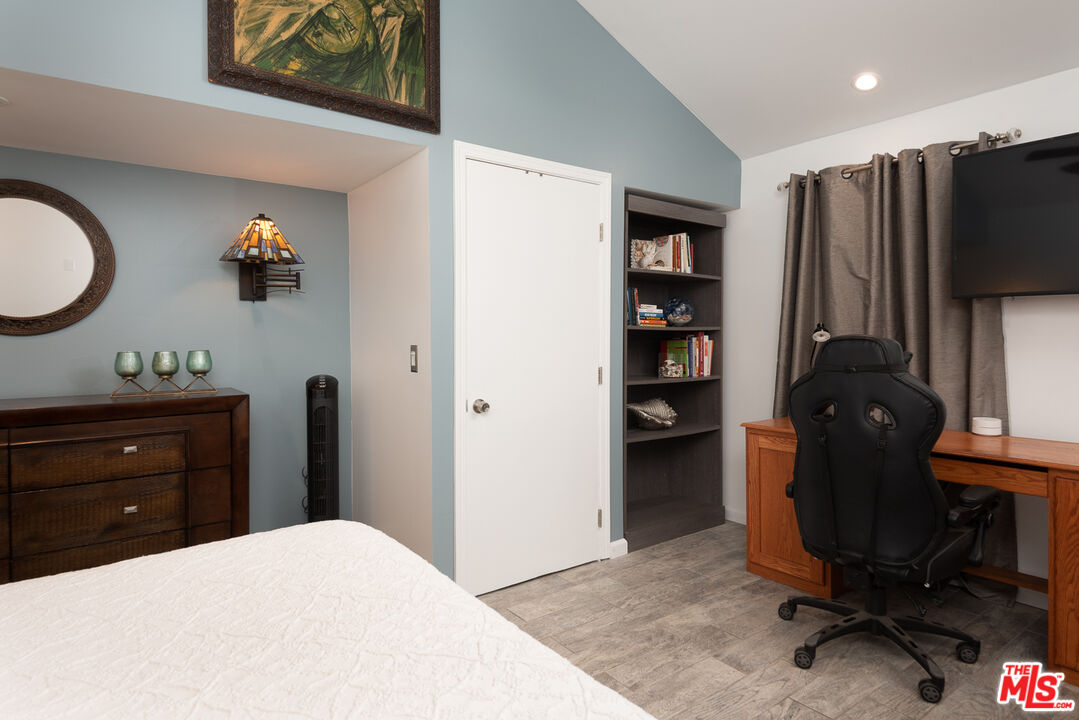 8308 Flight Avenue, Unit ADU Los Angeles, CA 90045 - Photo 21 of 27 a bedroom with a bed and a television