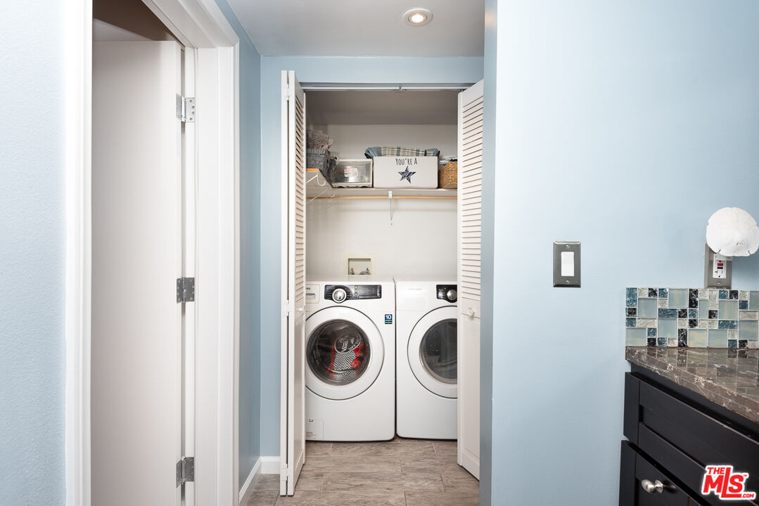 8308 Flight Avenue, Unit ADU Los Angeles, CA 90045 - Photo 22 of 27 a utility room with sink dryer and washer
