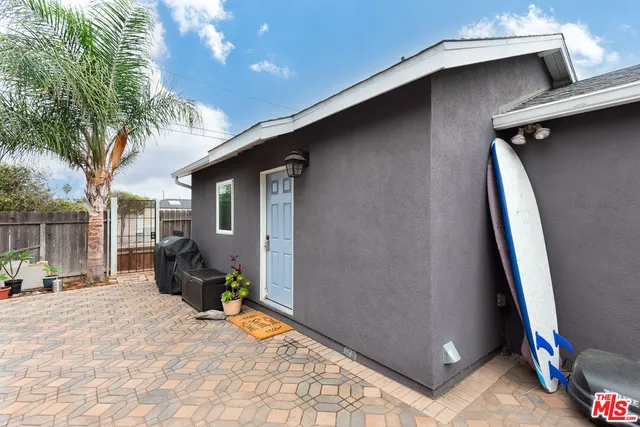 a view of outdoor space with deck area and furniture