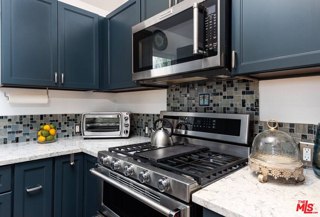 8308 Flight Avenue, Unit ADU Los Angeles, CA 90045 - Photo 5 of 27 a kitchen with stainless steel appliances granite countertop a stove and a microwave