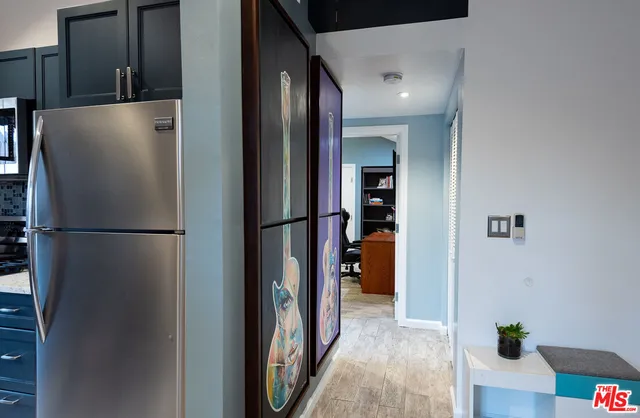 a view of a kitchen from the hallway