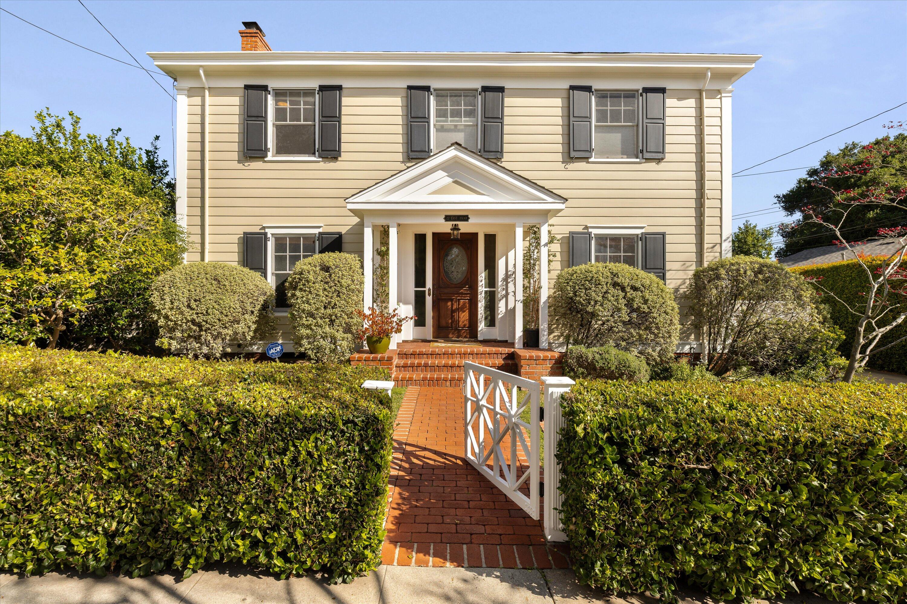 22 East Islay Street Santa Barbara, CA 93101 - Photo 1 of 26 a front view of a house with a yard