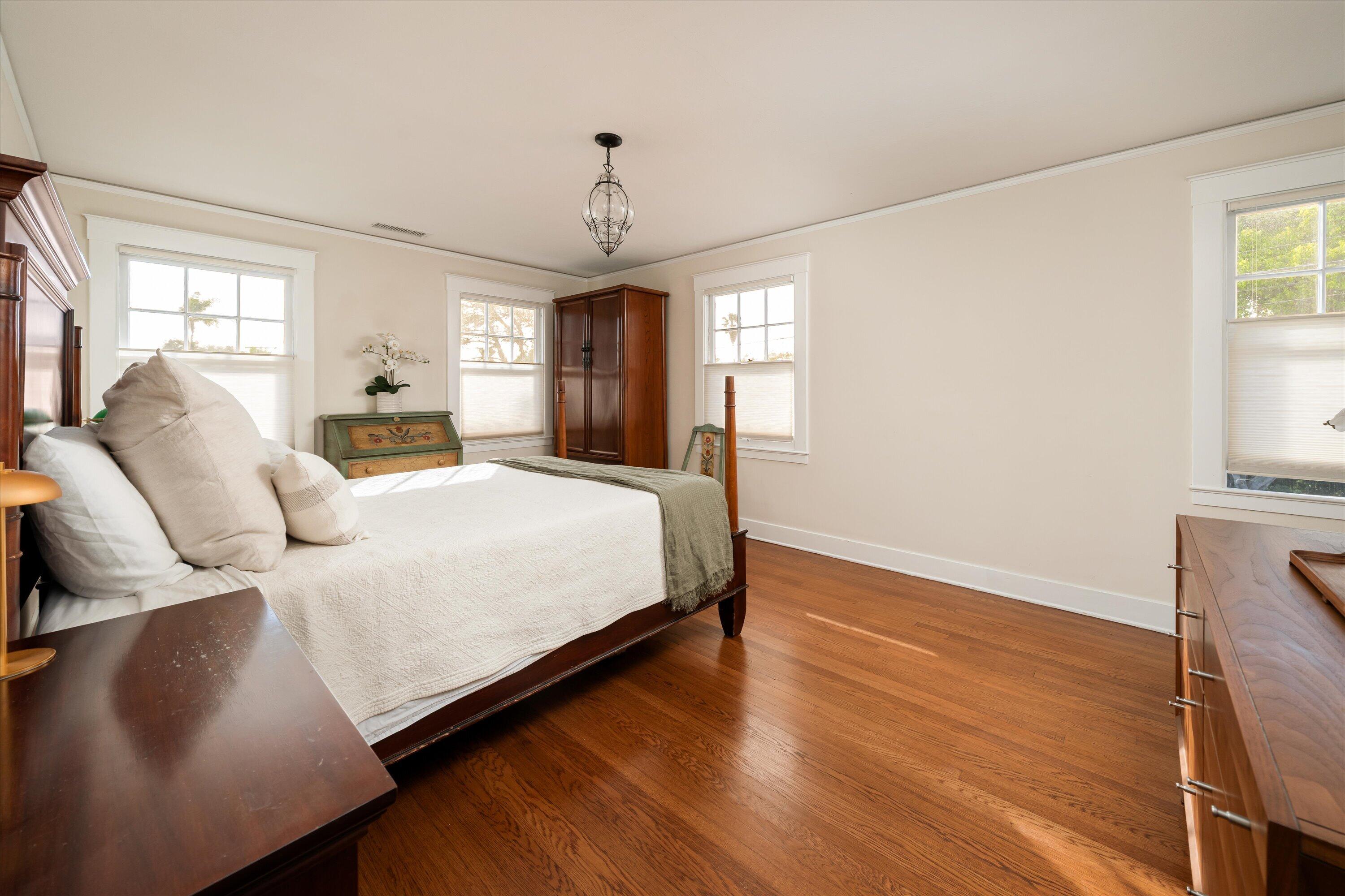 22 East Islay Street Santa Barbara, CA 93101 - Photo 14 of 26 a spacious bedroom with a bed and wooden floor