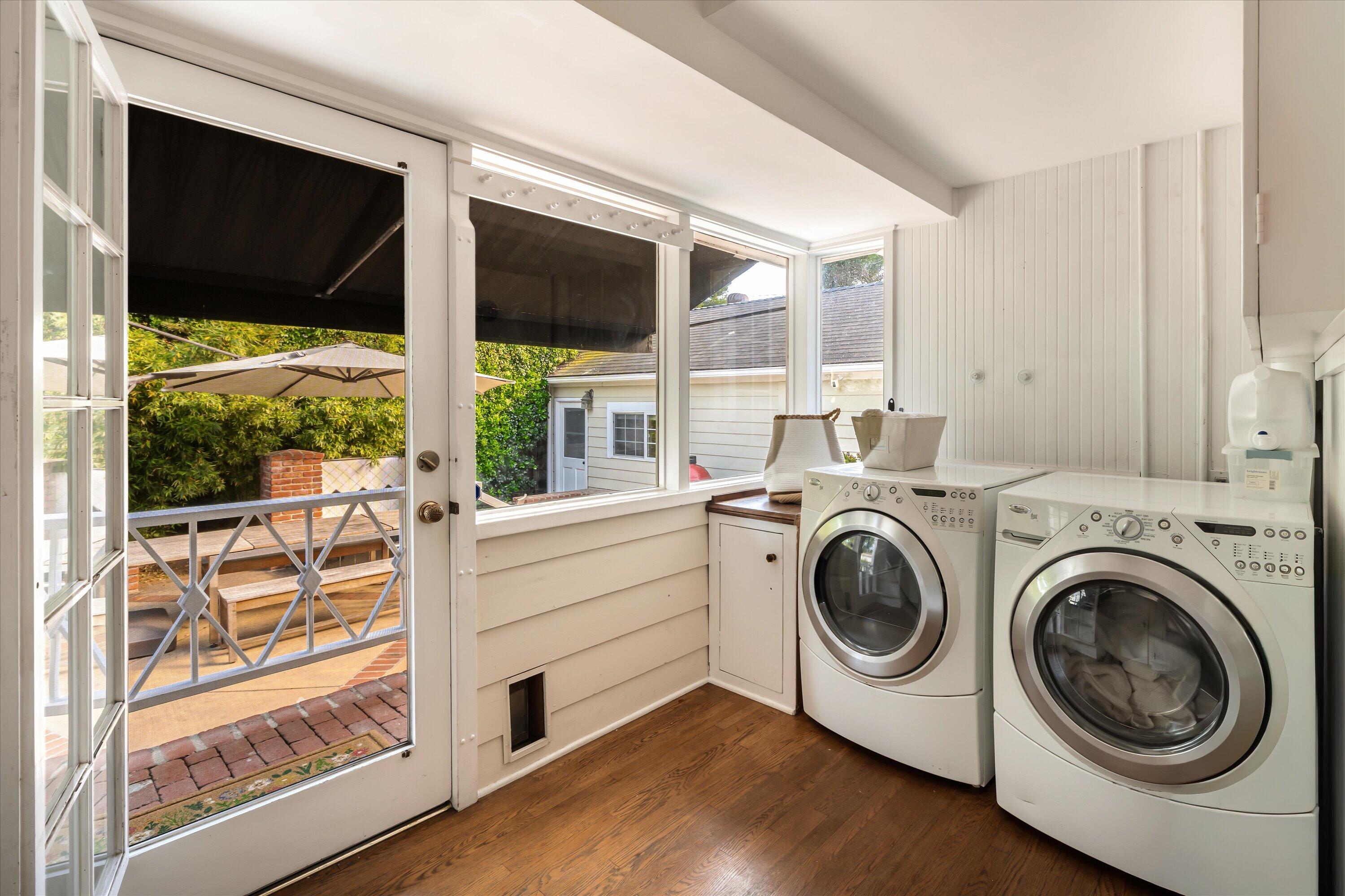 22 East Islay Street Santa Barbara, CA 93101 - Photo 17 of 26 a view of washer and dryer with kitchen in the background