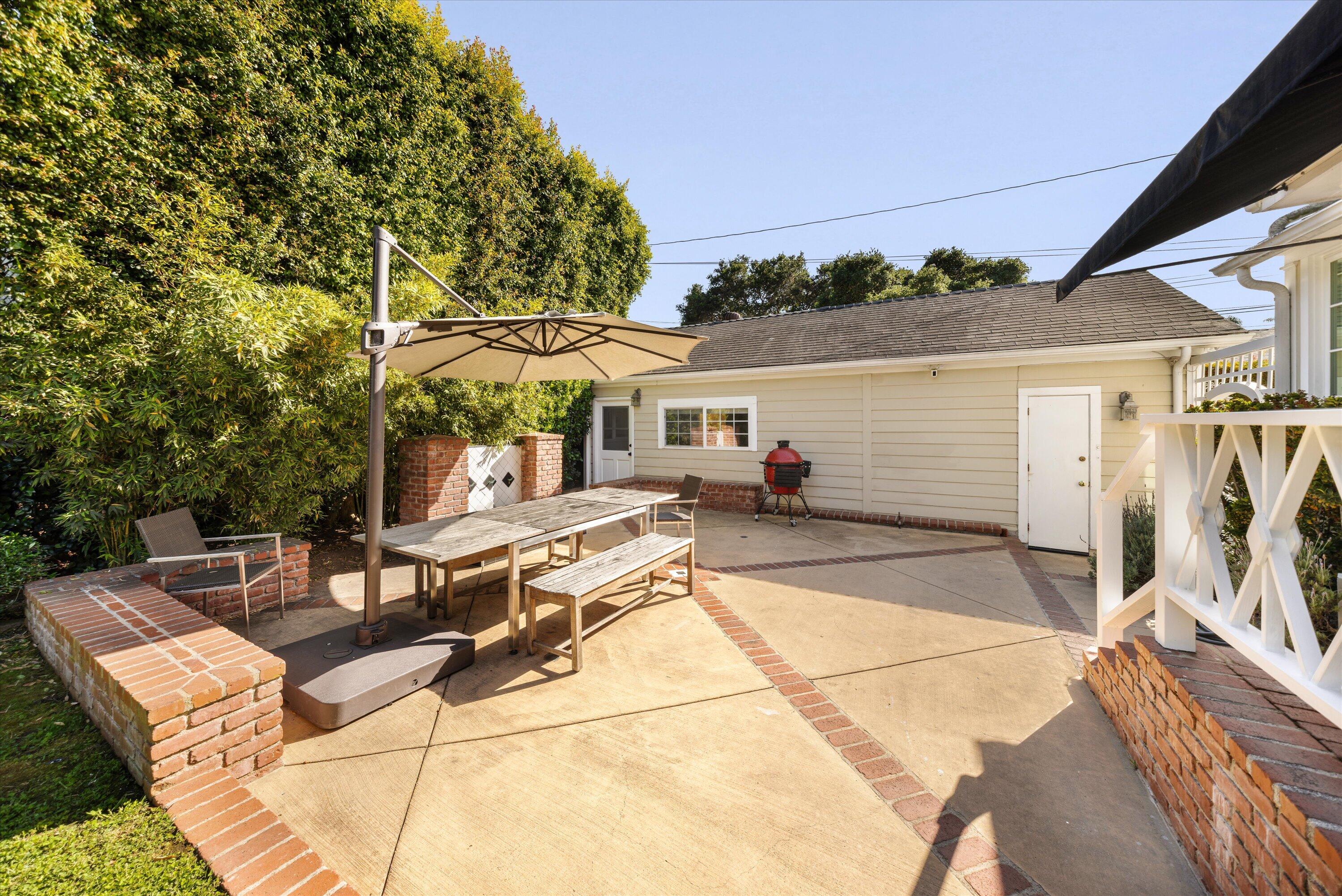 22 East Islay Street Santa Barbara, CA 93101 - Photo 18 of 26 a view of a patio with table and chairs and potted plants