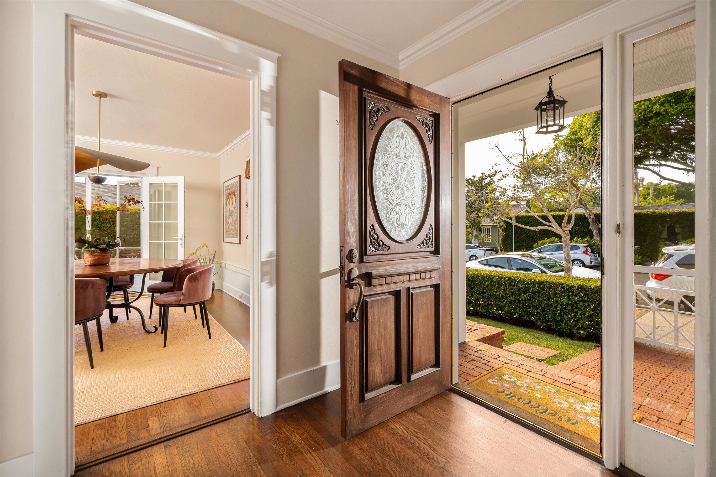 22 East Islay Street Santa Barbara, CA 93101 - Photo 2 of 26 a view of a hallway with dining area and glass door