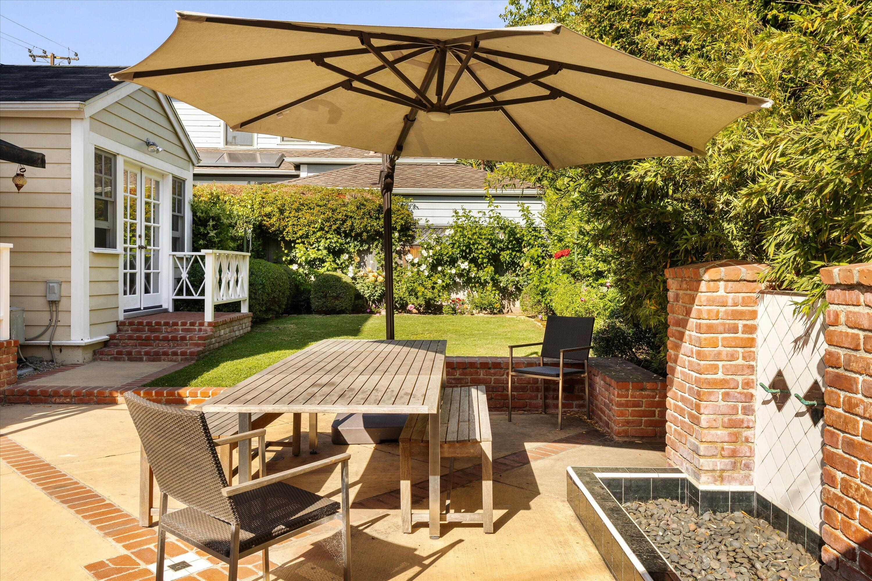 22 East Islay Street Santa Barbara, CA 93101 - Photo 21 of 26 a patio with a yard table and chairs