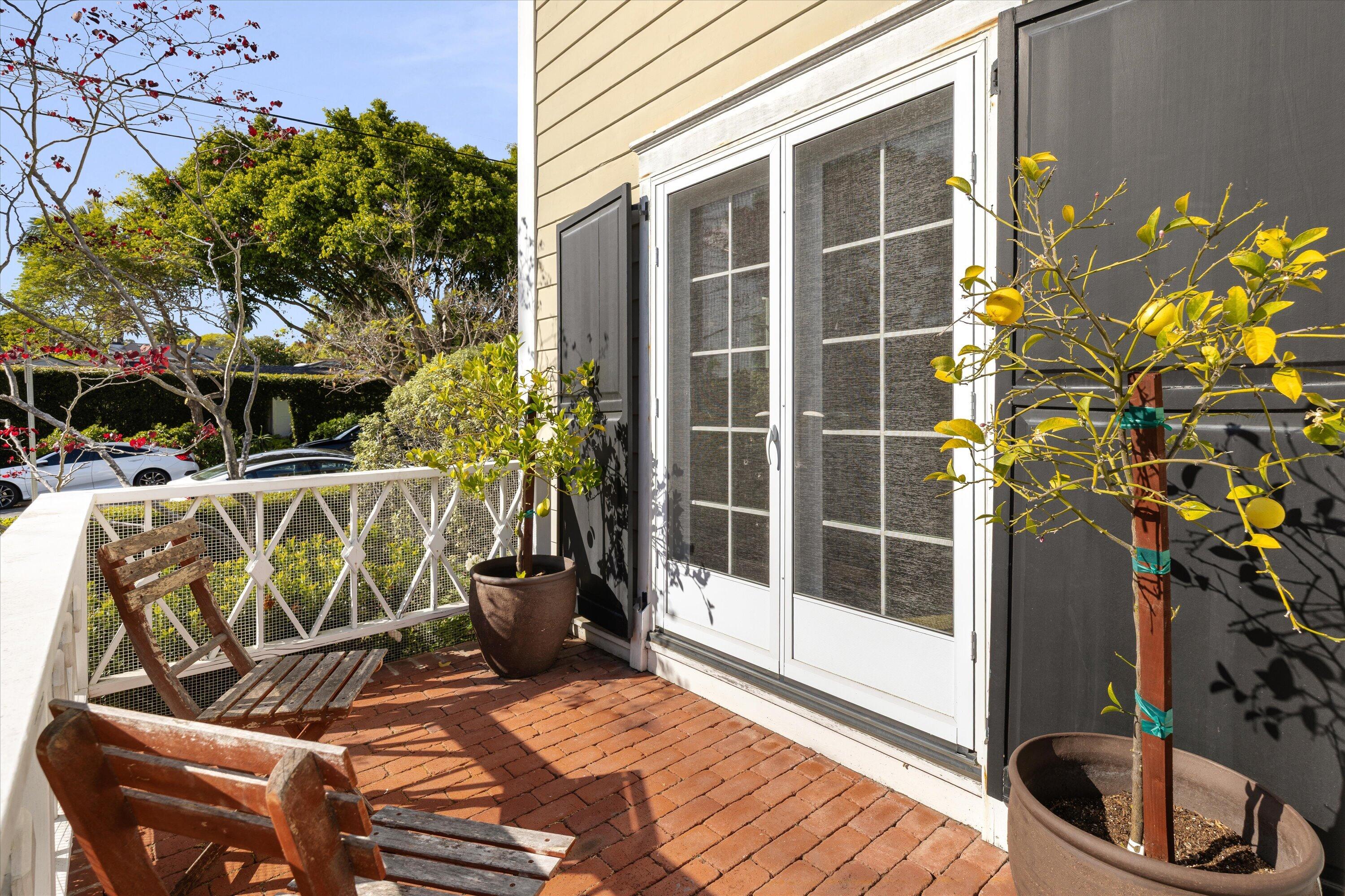 22 East Islay Street Santa Barbara, CA 93101 - Photo 23 of 26 a view of balcony with two chairs and a potted plant