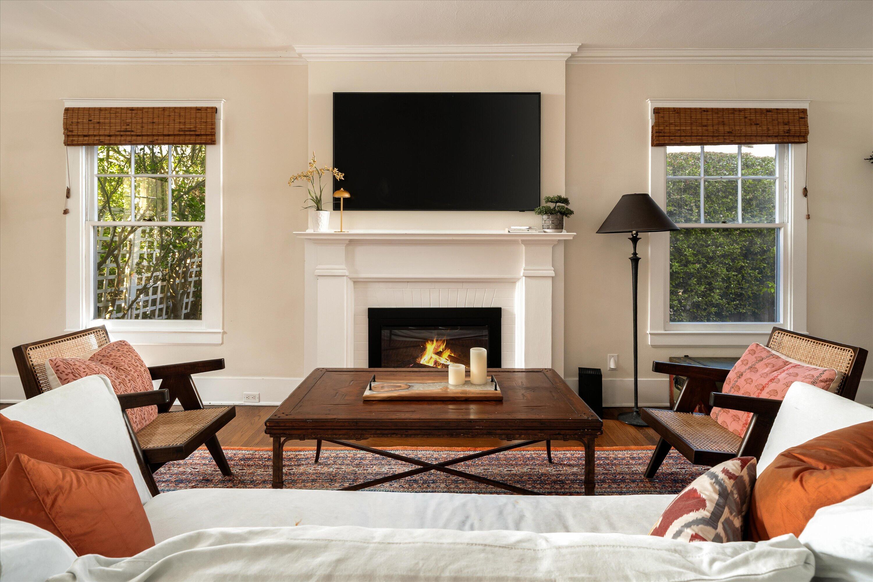 22 East Islay Street Santa Barbara, CA 93101 - Photo 4 of 26 a living room with furniture a flat screen tv and a fireplace