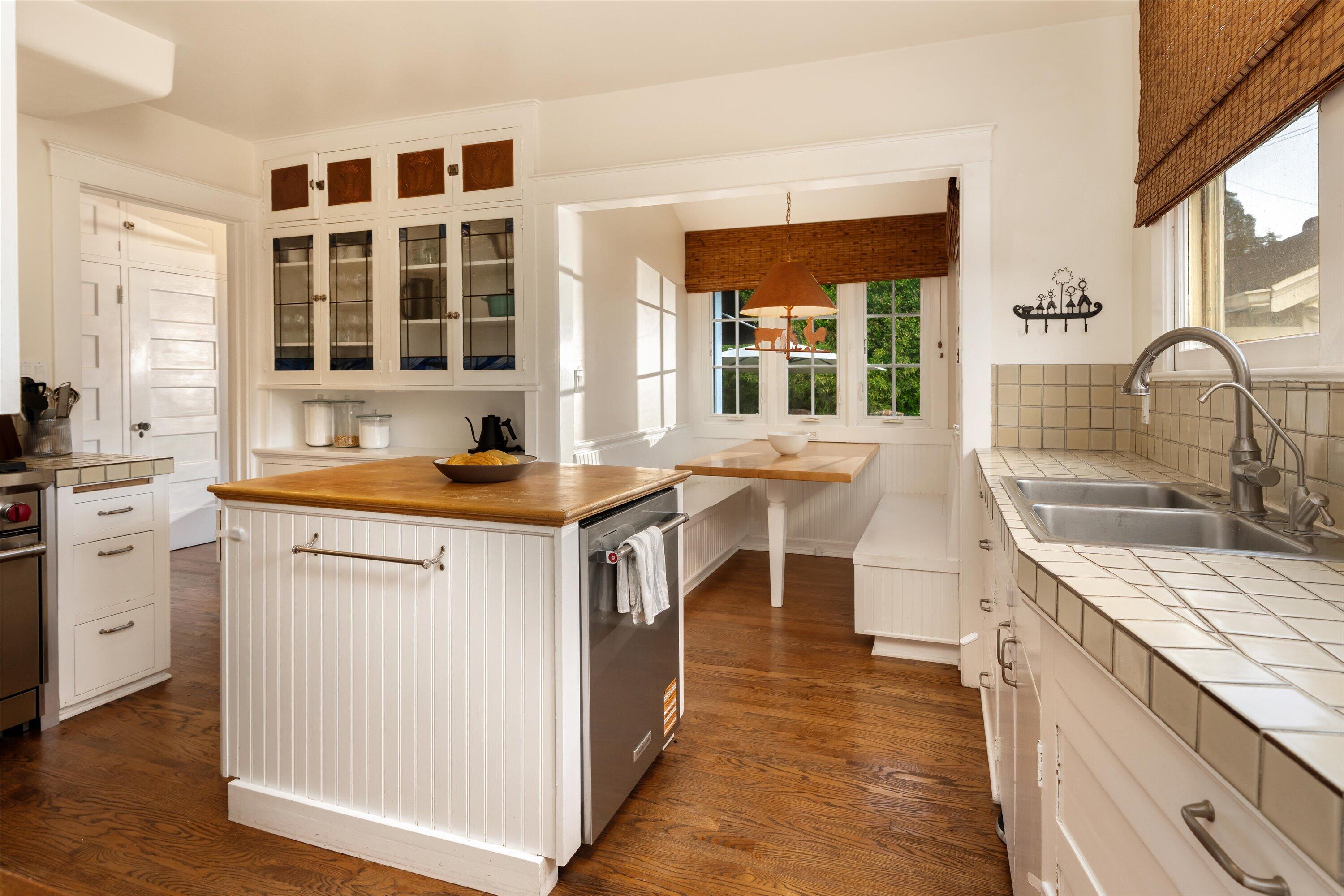 22 East Islay Street Santa Barbara, CA 93101 - Photo 7 of 26 a kitchen that has a lot of cabinets in it