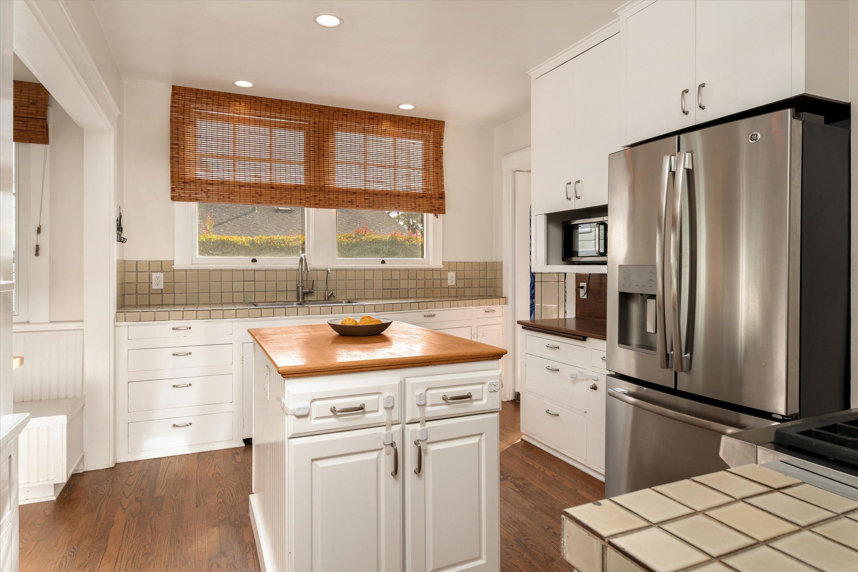 22 East Islay Street Santa Barbara, CA 93101 - Photo 9 of 26 a kitchen with refrigerator and cabinets