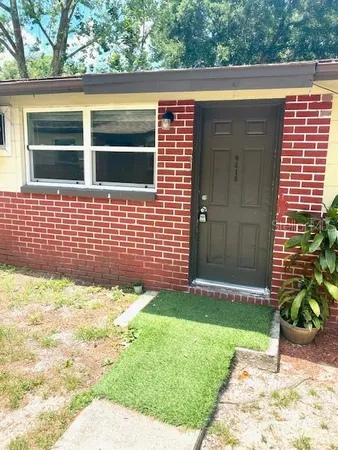 a backyard of a house with lots of green space
