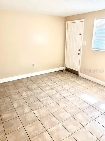 a view of a room with white walls