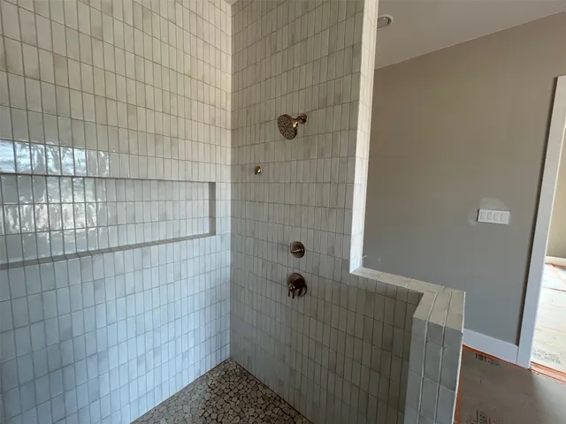 a bathroom with a granite countertop sink and vanity
