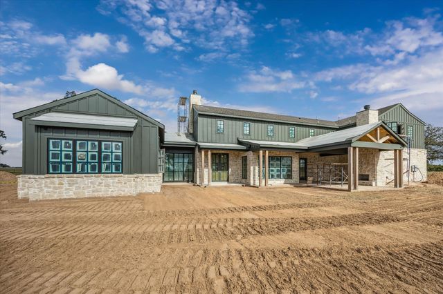 a room with a bed and a large window