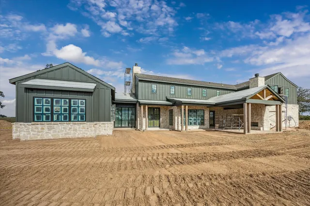 a room with a bed and a large window