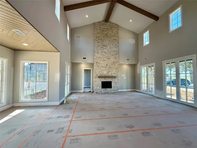 a view of an empty room and a fireplace