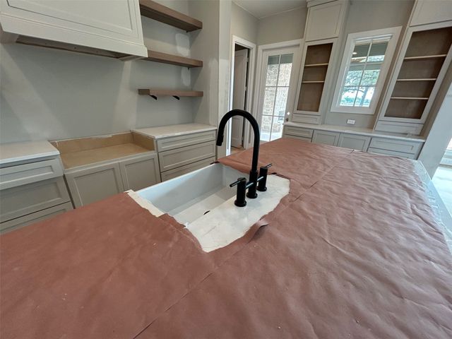 a view of a room with large windows