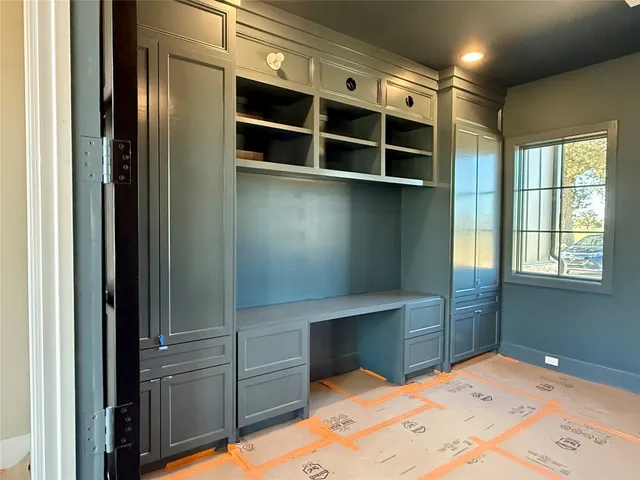 a bathroom with a glass door shower