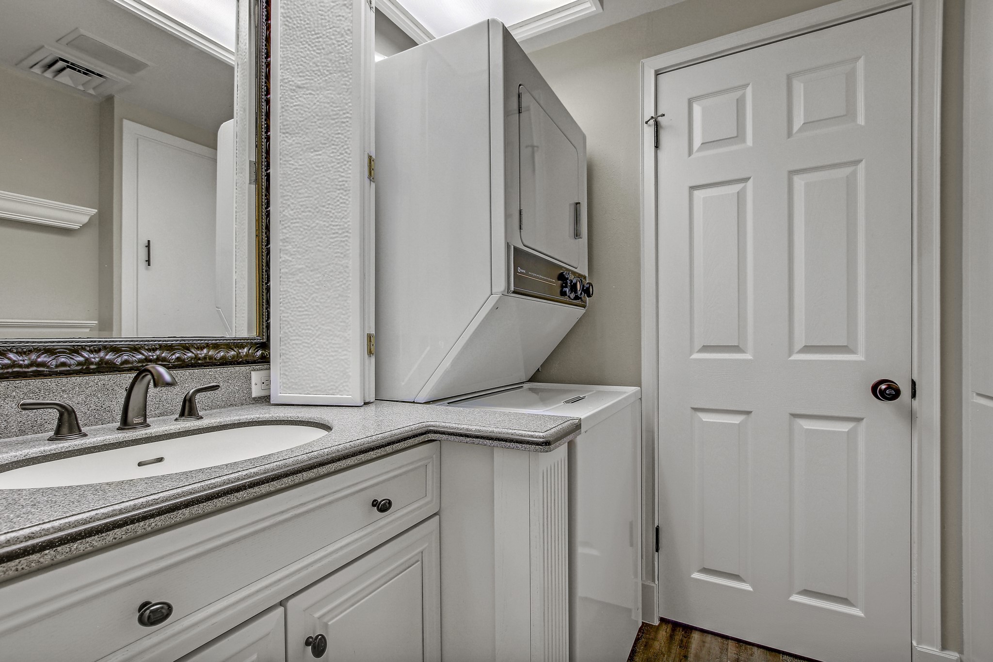 1801 Lavaca Street, Unit 5F Austin, TX 78701 - Photo 13 of 37 Laundry area with stacked washer / drying machine