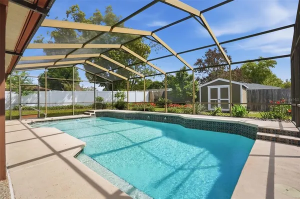 a view of a swimming pool with a patio