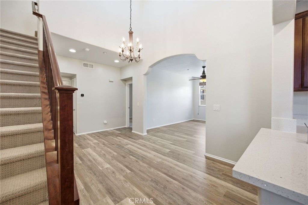 3603 Jetty Carlsbad, CA 92010 - Photo 18 of 43 a view of a hallway with wooden floor and staircase