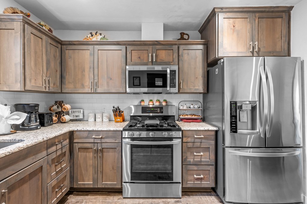 314 West Hackberry Street Fredericksburg, TX 78624 - Photo 11 of 25 a kitchen with a stove microwave and refrigerator