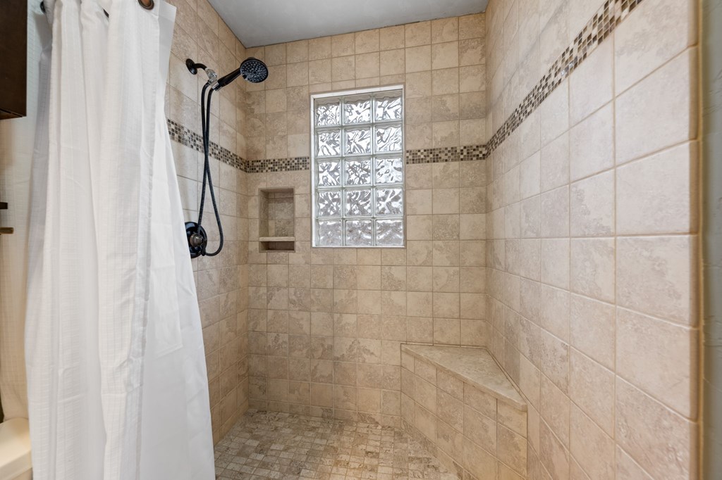 314 West Hackberry Street Fredericksburg, TX 78624 - Photo 17 of 25 a bathroom with a shower