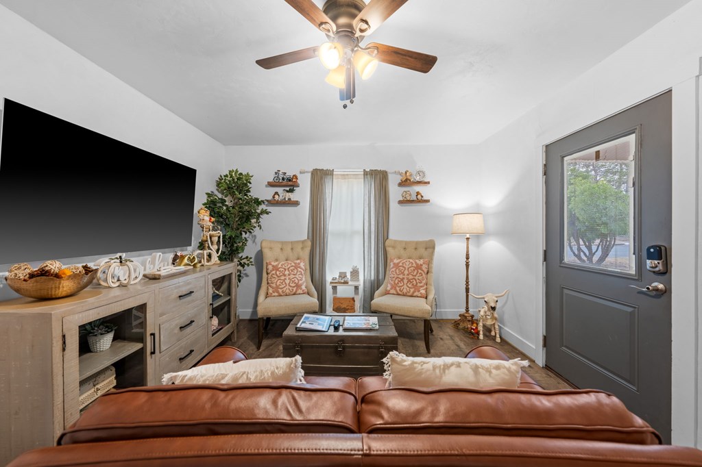 314 West Hackberry Street Fredericksburg, TX 78624 - Photo 7 of 25 a living room with furniture and a flat screen tv