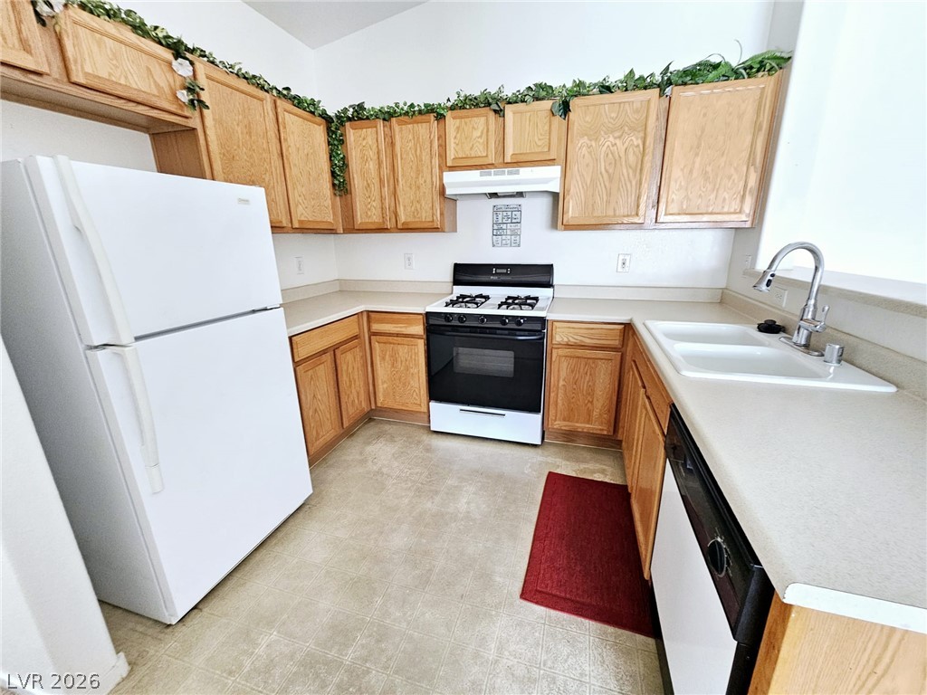 1663 Lefty Garcia Way Henderson, NV 89002 - Photo 25 of 31 A well-appointed kitchen features ample cabinetry, durable countertops, and essential appliances.