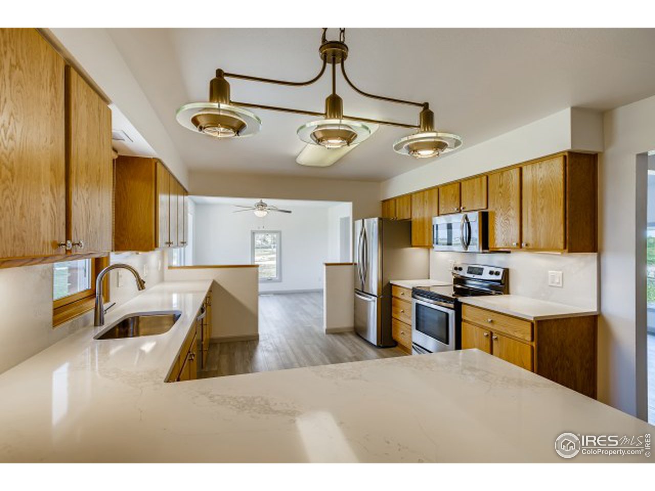 13165 East County Line Road Longmont, CO 80504 - Photo 23 of 39 Kitchen into dining room.