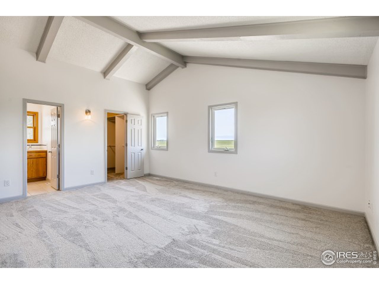 13165 East County Line Road Longmont, CO 80504 - Photo 28 of 39 Primary bedroom with views.