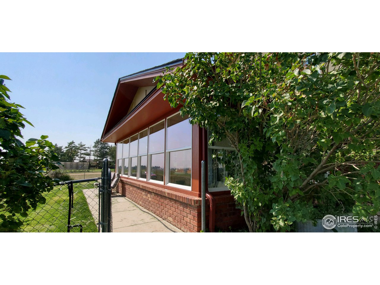 13165 East County Line Road Longmont, CO 80504 - Photo 37 of 39 Large Sunroom with New Windows