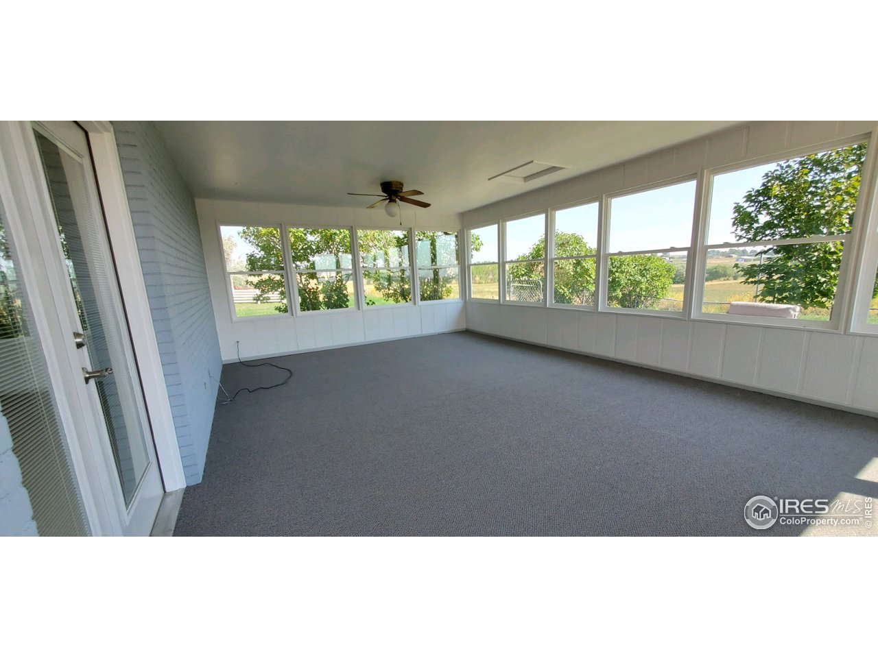 13165 East County Line Road Longmont, CO 80504 - Photo 39 of 39 Sunroom with New Carpet & Paint