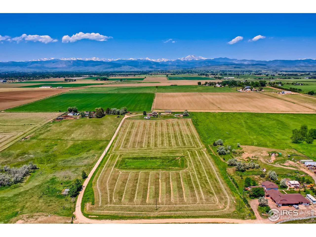 13165 East County Line Road Longmont, CO 80504 - Photo 5 of 39 Hay field and retention pond.