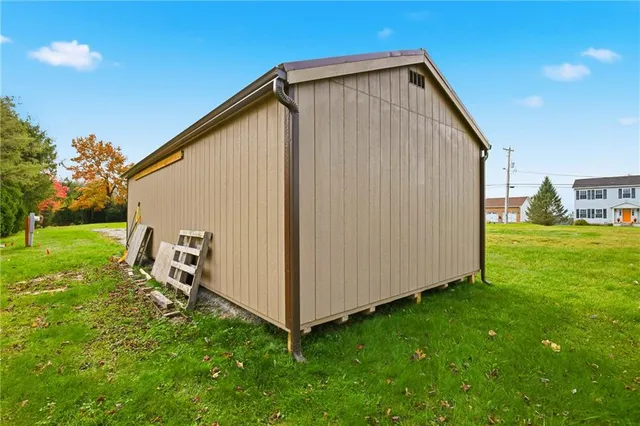 a view of backyard with garden and deck