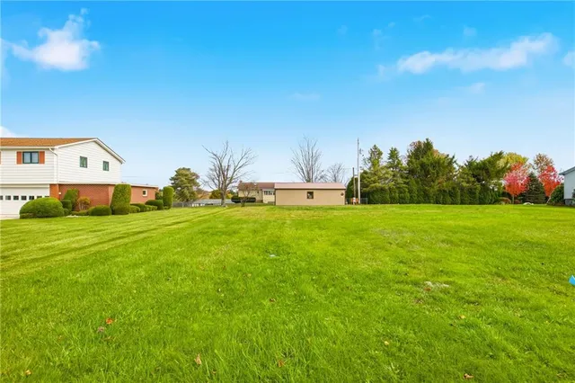 a view of a house with a big yard