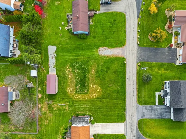 an aerial view of a house having yard