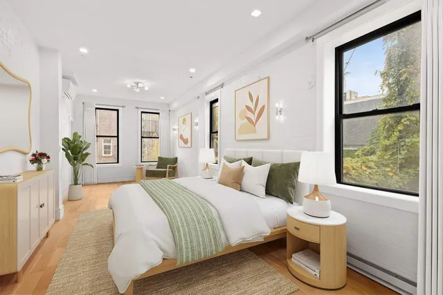 a bathroom with a white sink a toilet and a mirror