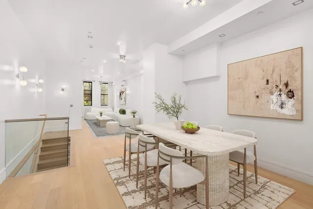 a view of hallway with wooden floor