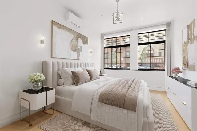 a kitchen with stainless steel appliances granite countertop a sink a stove and a refrigerator